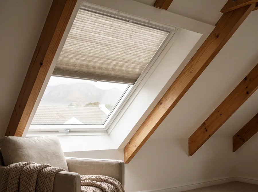 Pleated blind fitted flat against an angled skylight in a Southern Suburbs loft conversion